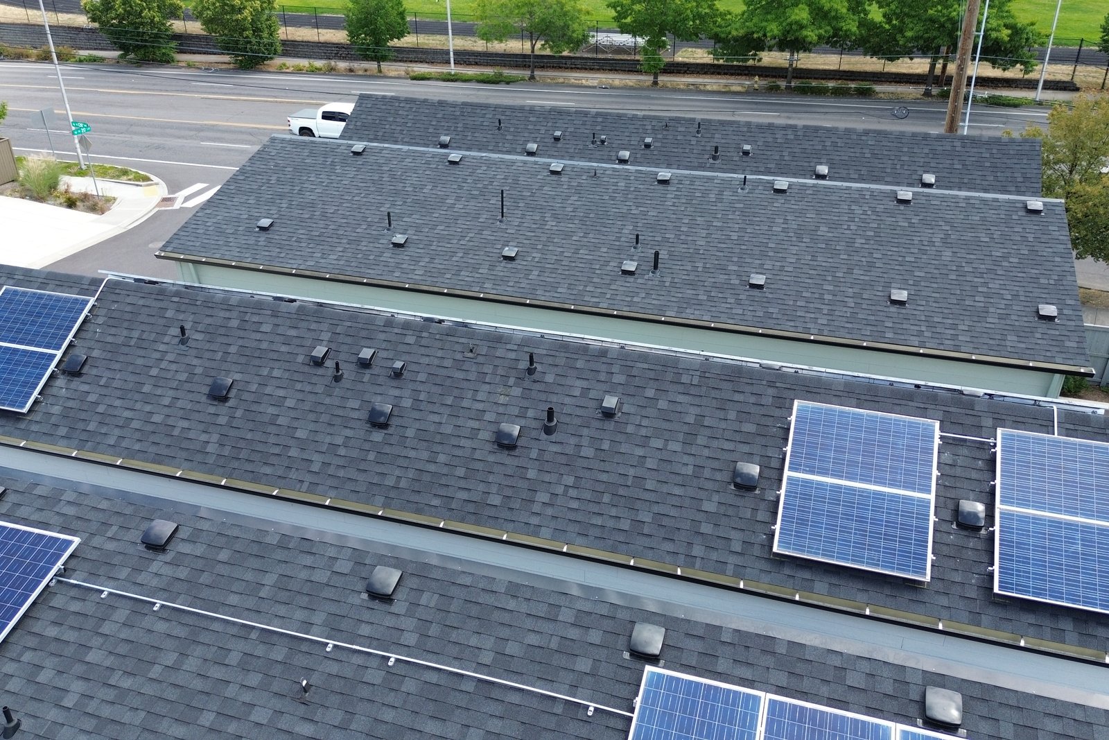 Aerial view of solar panels across several rooftops at NE 20th Circle
