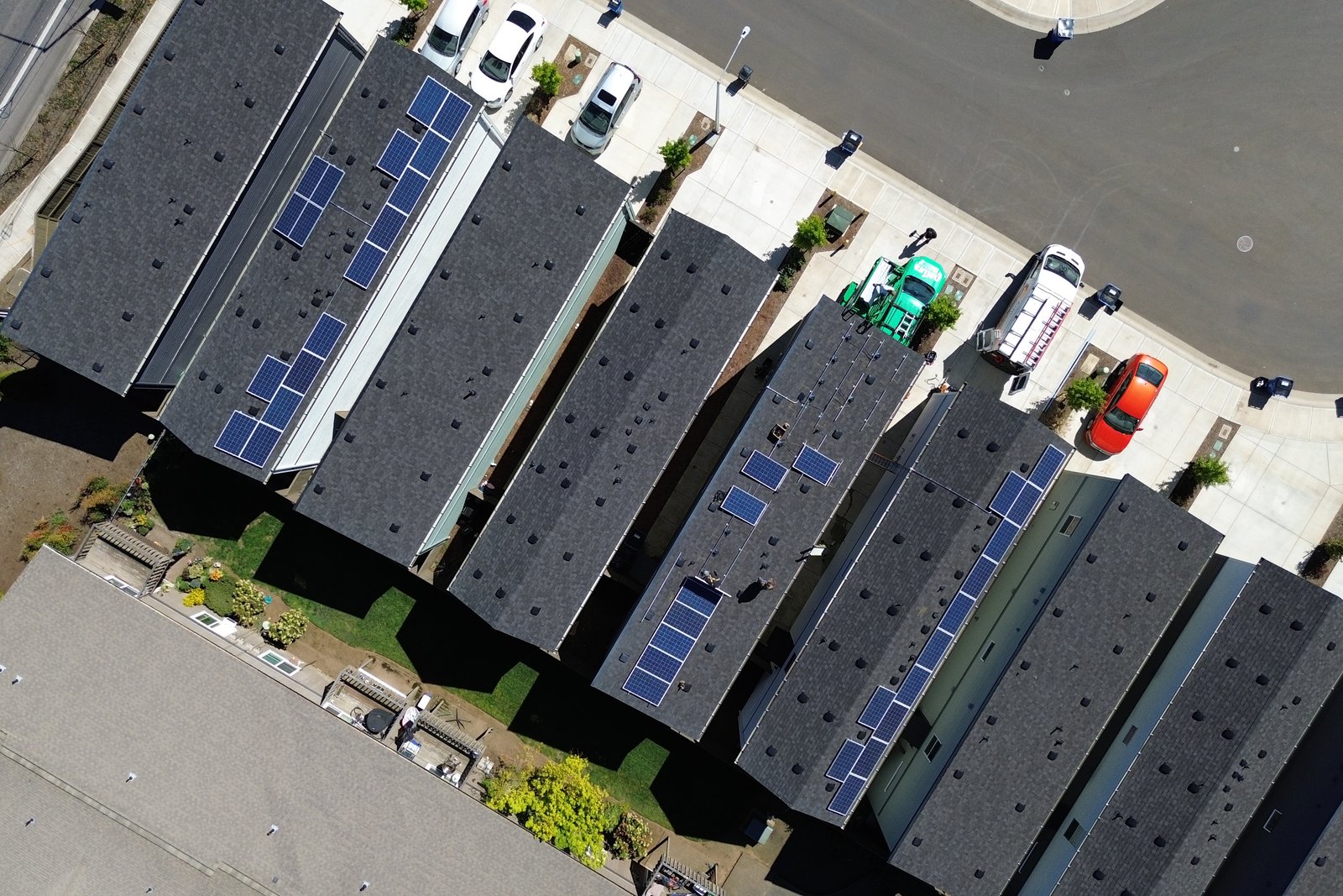 Aerial view of the installation crew working across several roofs