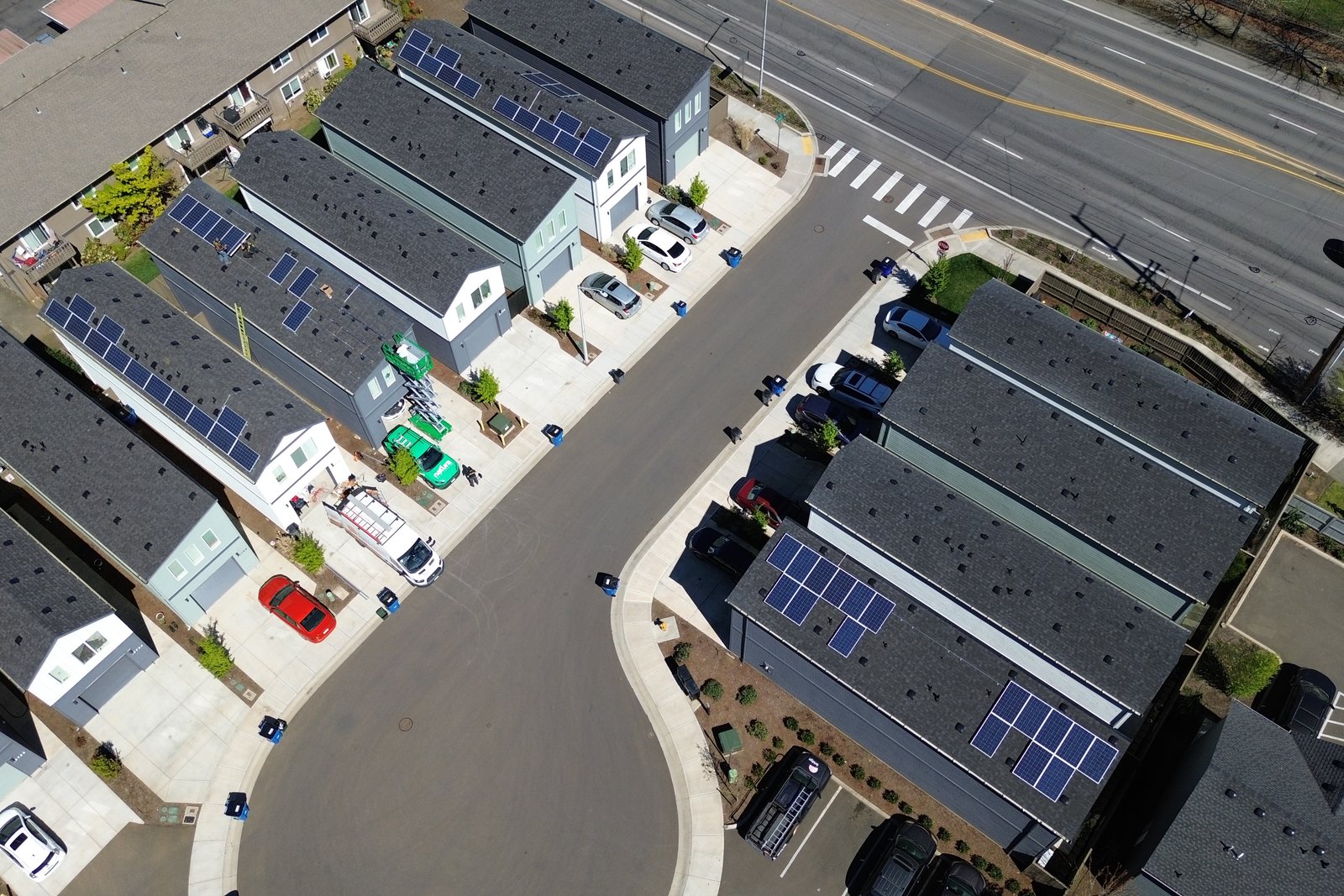 Aerial view of installation day, with crew vehicles parked along the street