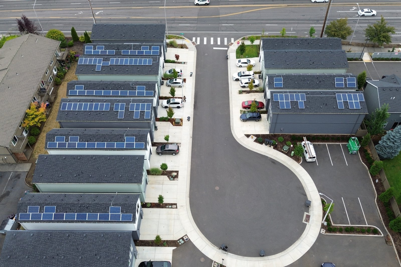 Aerial view down NE 20th Circle showing solar panels on homes along both sides of the street